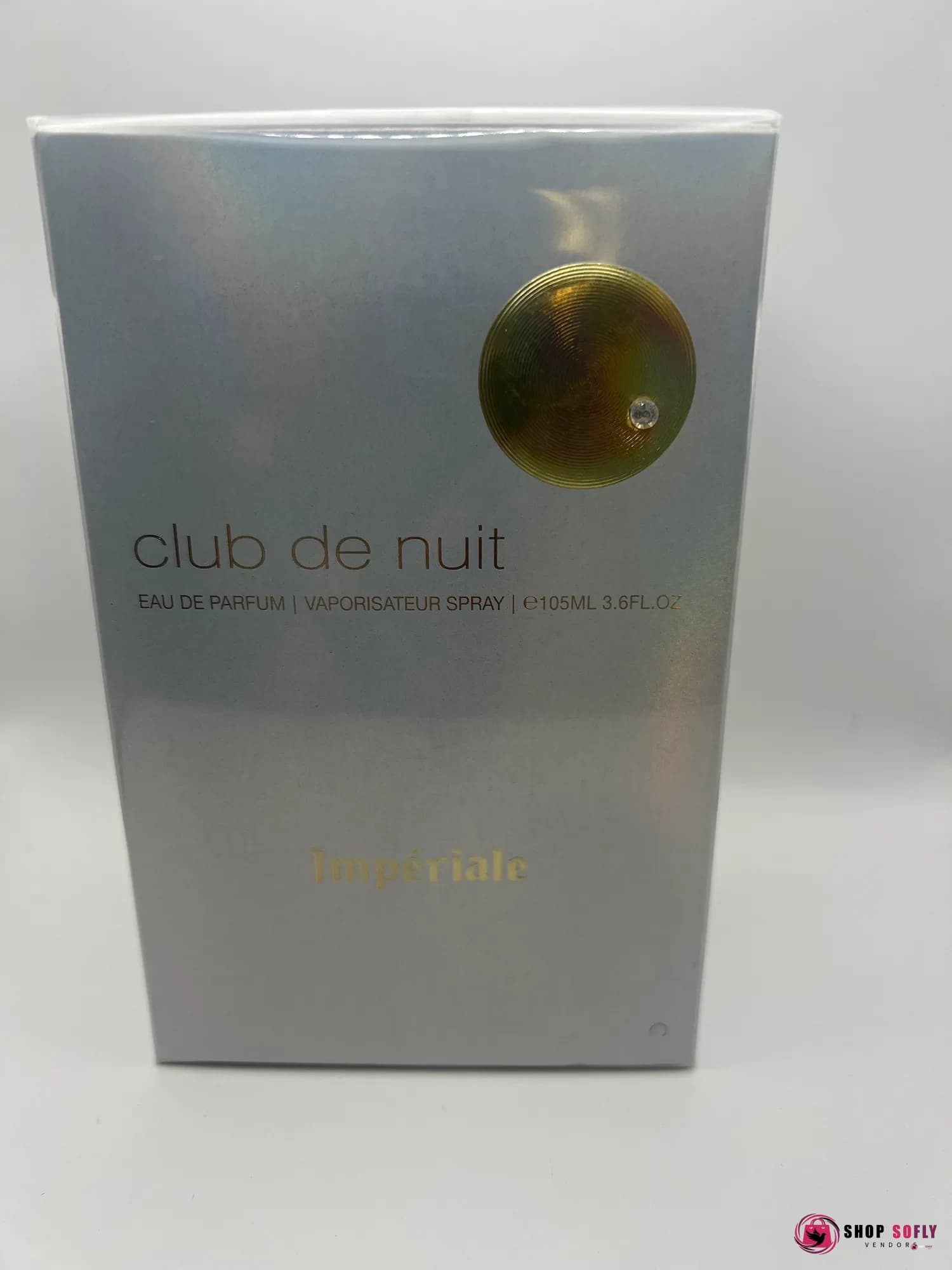 Silver perfume box with gold circle logo and crystal detail, 105ml.